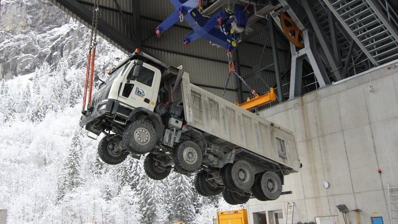 Illustration for article titled This Is How You "Fly" Trucks Up a 6,500-Foot Mountain With No Roads